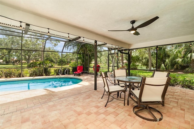 4353 Indian Point Trl, Sarasota, FL 34238 - outdoor pool featuring a patio area, glass enclosure, and a ceiling fan