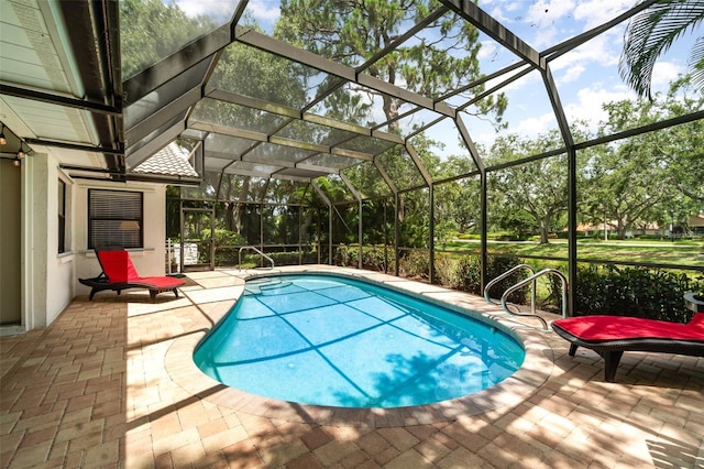 4353 Indian Point Trl, Sarasota, FL 34238 - outdoor pool with a patio, glass enclosure, and view of scattered trees
