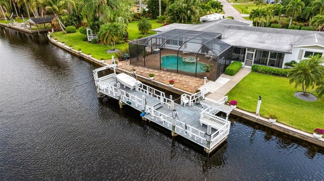 14544 Riverside Dr, Fort Myers, FL 33905 - dock area featuring a water view, an outdoor pool, glass enclosure, and a yard