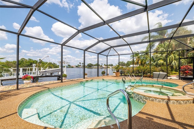 14544 Riverside Dr, Fort Myers, FL 33905 - view of pool with a boat dock, a water view, a patio area, boat lift, and a pool with connected hot tub