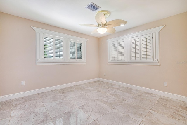 14544 Riverside Dr, Fort Myers, FL 33905 - empty room featuring baseboards and ceiling fan