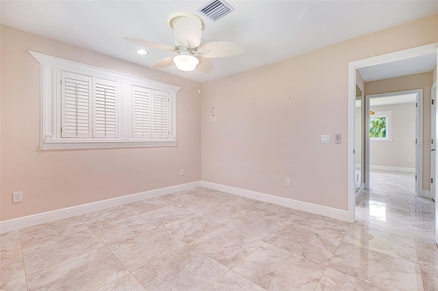 14544 Riverside Dr, Fort Myers, FL 33905 - spare room featuring ceiling fan, baseboards, recessed lighting, and light marble finish floors