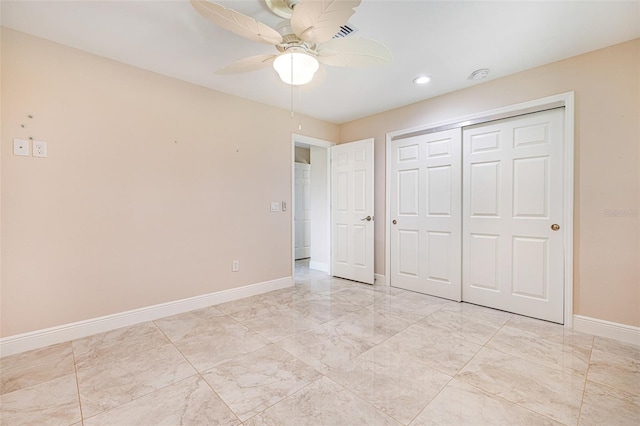 14544 Riverside Dr, Fort Myers, FL 33905 - unfurnished bedroom with baseboards, a closet, recessed lighting, a ceiling fan, and light marble finish flooring