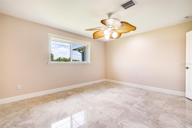 14544 Riverside Dr, Fort Myers, FL 33905 - empty room with a smoke detector, ceiling fan, and baseboards