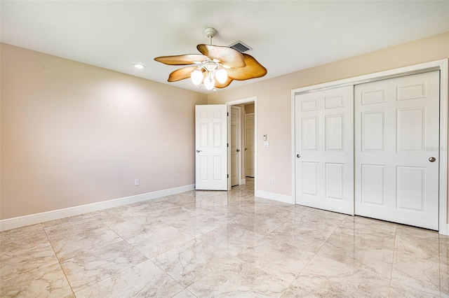14544 Riverside Dr, Fort Myers, FL 33905 - unfurnished bedroom with baseboards, light marble finish flooring, a closet, recessed lighting, and ceiling fan