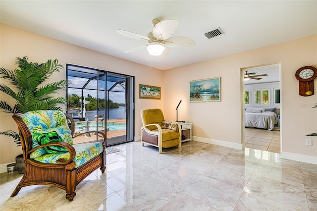 14544 Riverside Dr, Fort Myers, FL 33905 - sitting room with ceiling fan, light marble finish floors, and baseboards