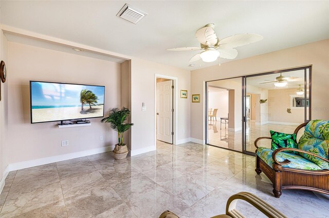 14544 Riverside Dr, Fort Myers, FL 33905 - entryway featuring ceiling fan, light marble finish floors, and baseboards
