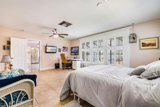 14544 Riverside Dr, Fort Myers, FL 33905 - bedroom with light tile patterned floors, an office area, baseboards, and ceiling fan