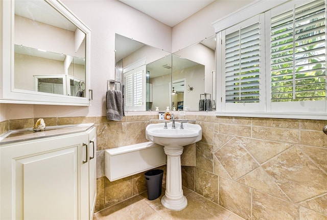 14544 Riverside Dr, Fort Myers, FL 33905 - bathroom featuring tile walls and stone tile flooring