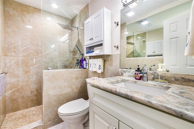 14544 Riverside Dr, Fort Myers, FL 33905 - bathroom with a walk in shower, tile walls, vanity, and toilet