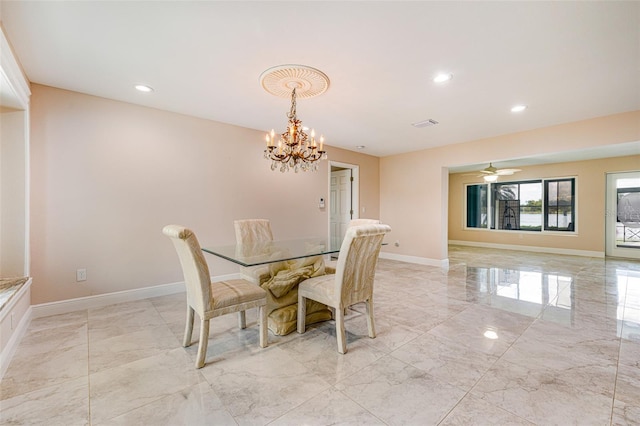 14544 Riverside Dr, Fort Myers, FL 33905 - dining room with light marble finish floors, a chandelier, recessed lighting, and baseboards