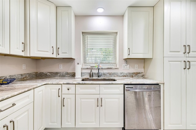 14544 Riverside Dr, Fort Myers, FL 33905 - kitchen with dishwasher, a sink, and white cabinetry