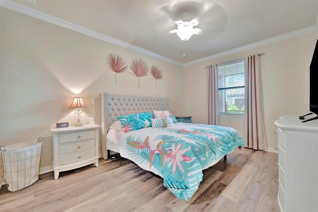 5528 Palmer Cir Unit 104, Bradenton, FL 34211 - bedroom featuring light wood-style flooring, ornamental molding, and baseboards