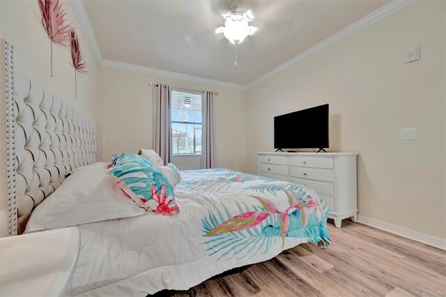 5528 Palmer Cir Unit 104, Bradenton, FL 34211 - bedroom featuring light wood-type flooring, ornamental molding, baseboards, and ceiling fan