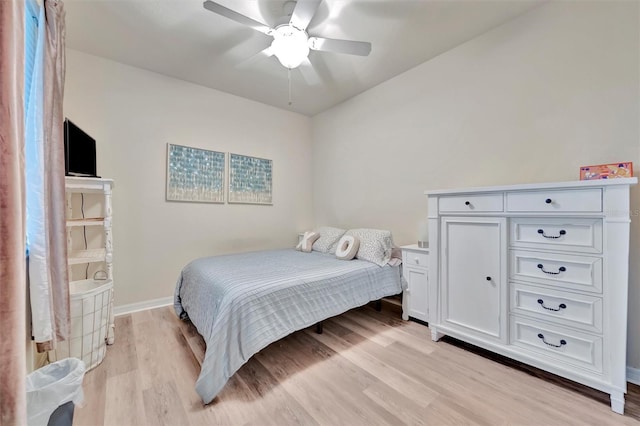 5528 Palmer Cir Unit 104, Bradenton, FL 34211 - bedroom with light wood-style floors and ceiling fan