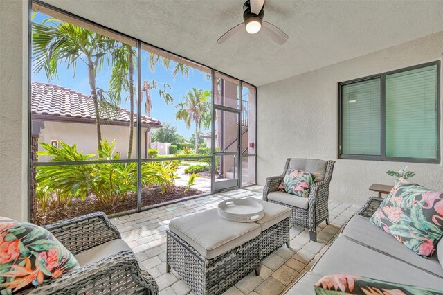 5528 Palmer Cir Unit 104, Bradenton, FL 34211 - sunroom with a ceiling fan and an outdoor hangout area