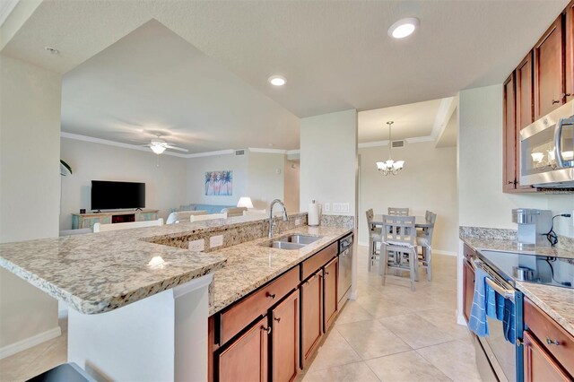 5528 Palmer Cir Unit 104, Bradenton, FL 34211 - kitchen with a sink, appliances with stainless steel finishes, ceiling fan, ornamental molding, and light stone countertops