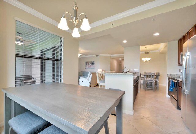 5528 Palmer Cir Unit 104, Bradenton, FL 34211 - dining space featuring a chandelier, ornamental molding, light tile patterned floors, recessed lighting, and baseboards