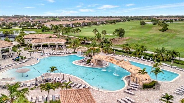 5528 Palmer Cir Unit 104, Bradenton, FL 34211 - community pool with view of golf course, a pergola, and a residential view