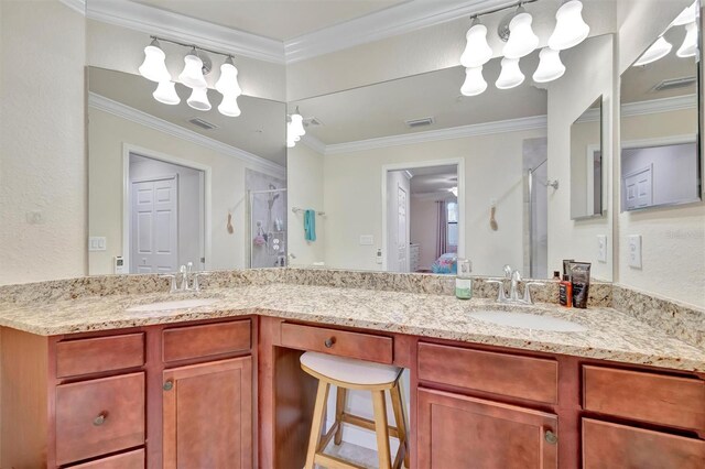 5528 Palmer Cir Unit 104, Bradenton, FL 34211 - bathroom featuring a stall shower, double vanity, a chandelier, and ornamental molding