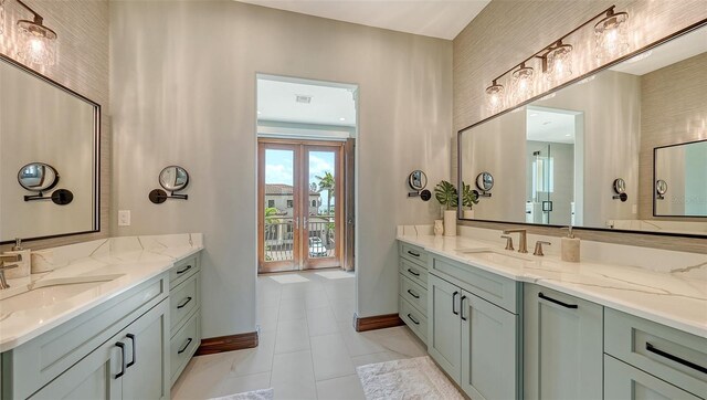795 Marbury Ln, Longboat Key, FL 34228 - bathroom with two vanities and tile patterned floors