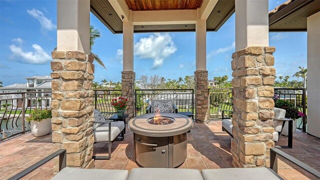 795 Marbury Ln, Longboat Key, FL 34228 - view of patio with an outdoor fire pit