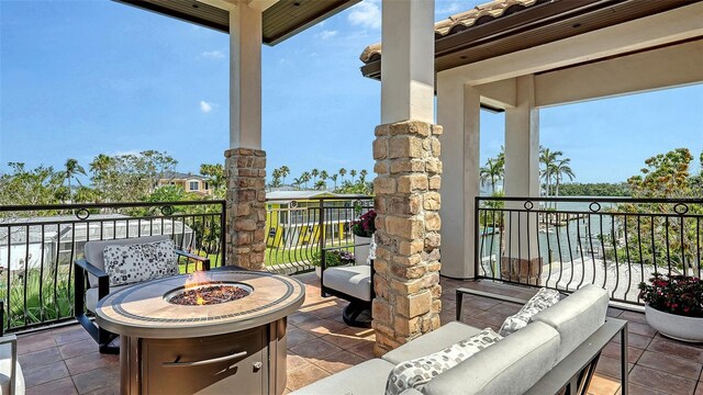 795 Marbury Ln, Longboat Key, FL 34228 - patio / terrace with an outdoor fire pit