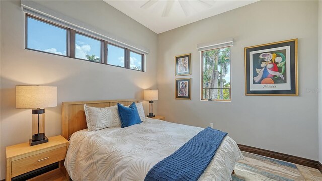 795 Marbury Ln, Longboat Key, FL 34228 - bedroom with wood finished floors and a ceiling fan
