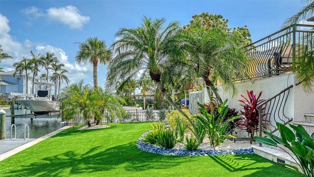795 Marbury Ln, Longboat Key, FL 34228 - view of grassy yard featuring boat lift and a dock