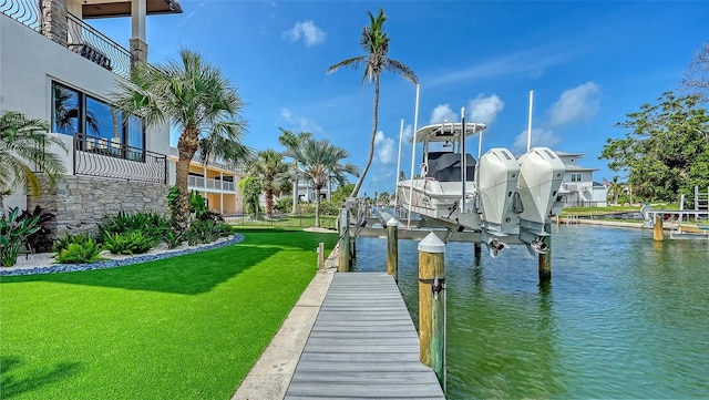 795 Marbury Ln, Longboat Key, FL 34228 - dock area featuring boat lift, a water view, and a yard