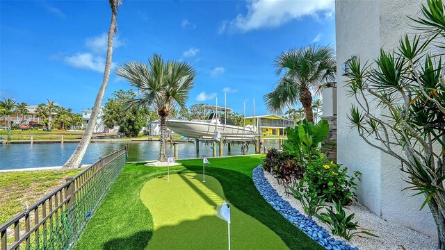 795 Marbury Ln, Longboat Key, FL 34228 - view of yard featuring a putting green, boat lift, a water view, and a boat dock