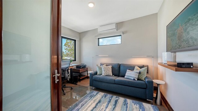 795 Marbury Ln, Longboat Key, FL 34228 - office area with an AC wall unit and wood finished floors
