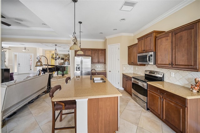 305 Siena Vista Pl, Sun City Center, FL 33573 - kitchen featuring stainless steel appliances, light stone counters, a breakfast bar area, an island with sink, and light tile patterned floors