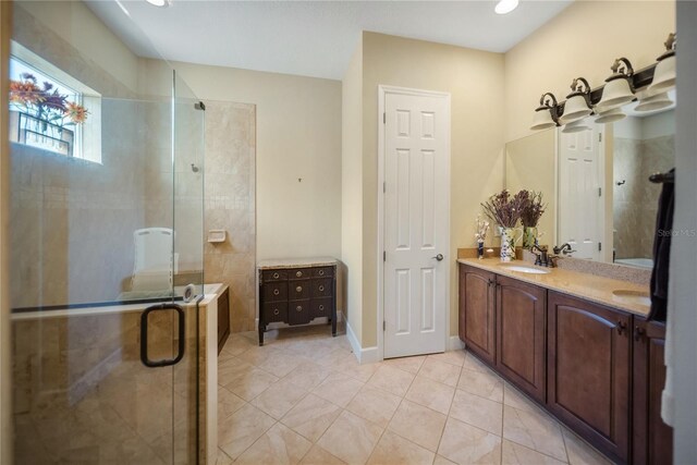 305 Siena Vista Pl, Sun City Center, FL 33573 - bathroom with double vanity, a shower stall, and tile patterned floors