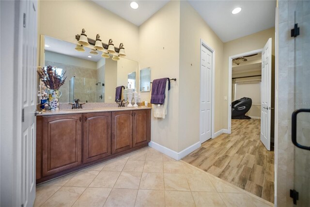 305 Siena Vista Pl, Sun City Center, FL 33573 - full bathroom with a stall shower, double vanity, and recessed lighting