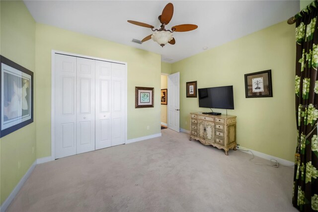 305 Siena Vista Pl, Sun City Center, FL 33573 - bedroom featuring a closet, carpet floors, and a ceiling fan