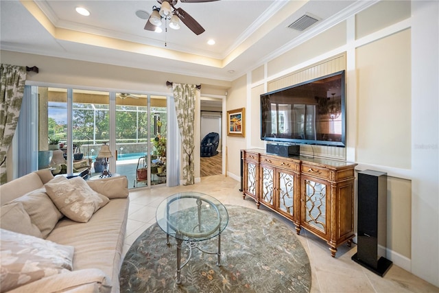 305 Siena Vista Pl, Sun City Center, FL 33573 - tiled living area featuring a ceiling fan, ornamental molding, a raised ceiling, and recessed lighting