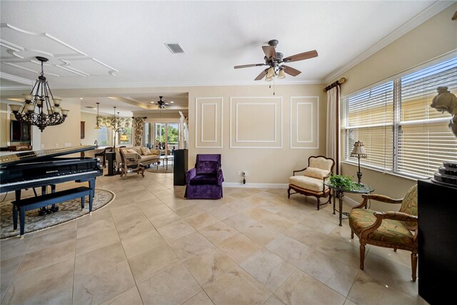 305 Siena Vista Pl, Sun City Center, FL 33573 - living room featuring a ceiling fan, crown molding, and a chandelier