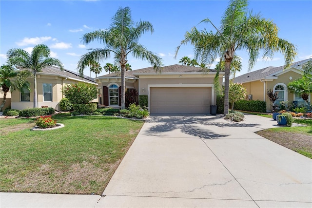 305 Siena Vista Pl, Sun City Center, FL 33573 - ranch-style home with stucco siding, a garage, driveway, and a front yard