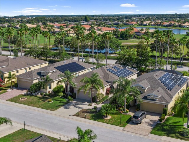 305 Siena Vista Pl, Sun City Center, FL 33573 - aerial perspective of suburban area with a large body of water
