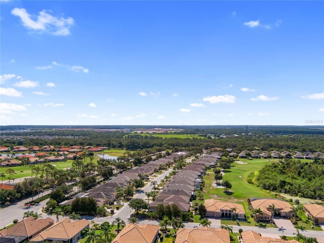 305 Siena Vista Pl, Sun City Center, FL 33573 - aerial perspective of suburban area with a golf course