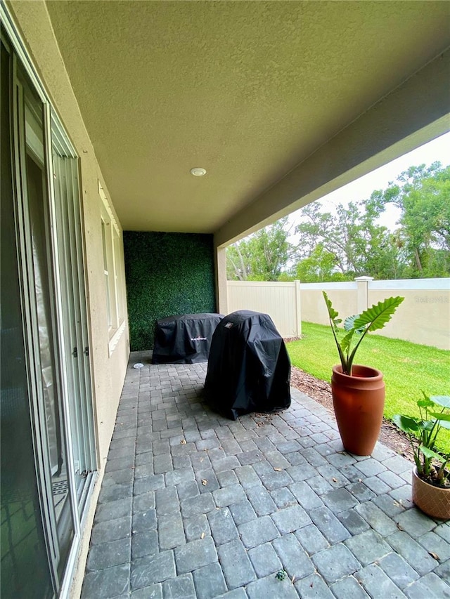11613 Woodleaf Dr, Lakewood Ranch, FL 34211 - fenced backyard featuring a patio area and a grill