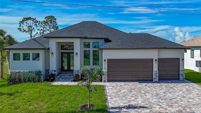 1167 Boundary Blvd, Rotonda West, FL 33947 - view of front of property with french doors, stucco siding, a garage, and decorative driveway