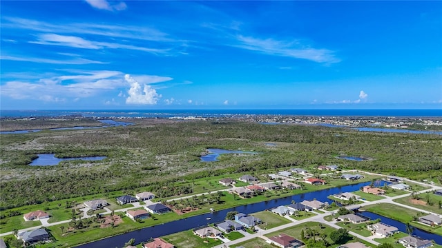 1167 Boundary Blvd, Rotonda West, FL 33947 - aerial perspective of suburban area with a large body of water