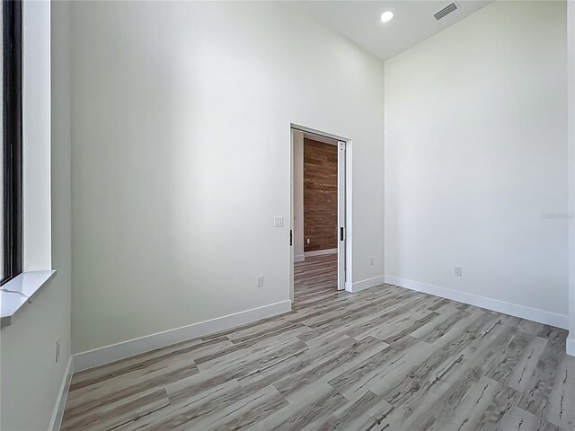 1167 Boundary Blvd, Rotonda West, FL 33947 - spare room with light wood-type flooring and recessed lighting