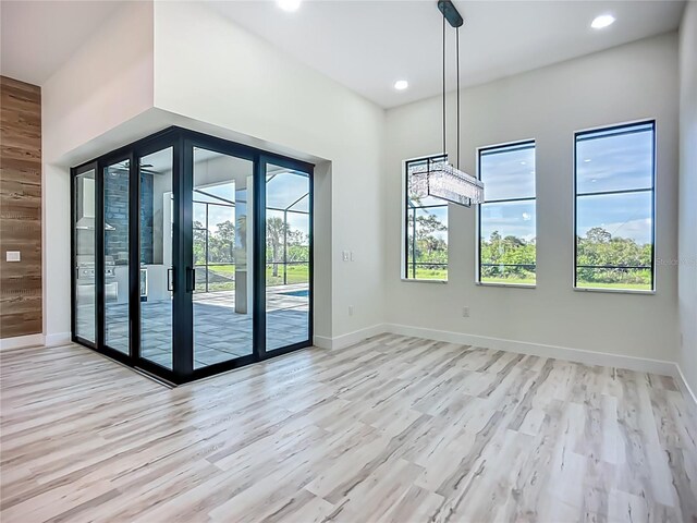 1167 Boundary Blvd, Rotonda West, FL 33947 - unfurnished dining area with light wood finished floors and recessed lighting
