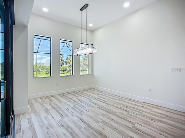 1167 Boundary Blvd, Rotonda West, FL 33947 - unfurnished room featuring recessed lighting and light wood-style flooring