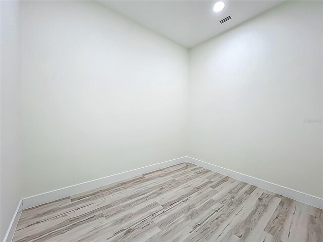 1167 Boundary Blvd, Rotonda West, FL 33947 - empty room featuring light wood finished floors and recessed lighting
