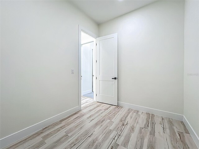 1167 Boundary Blvd, Rotonda West, FL 33947 - spare room with light wood-style flooring and baseboards