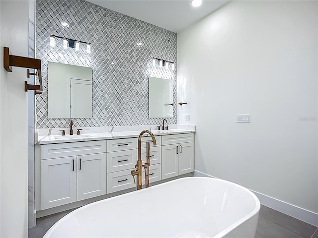 1167 Boundary Blvd, Rotonda West, FL 33947 - full bathroom featuring a freestanding tub, double vanity, and backsplash